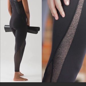Lululemon black high waisted with mesh calf and open detail up the legs